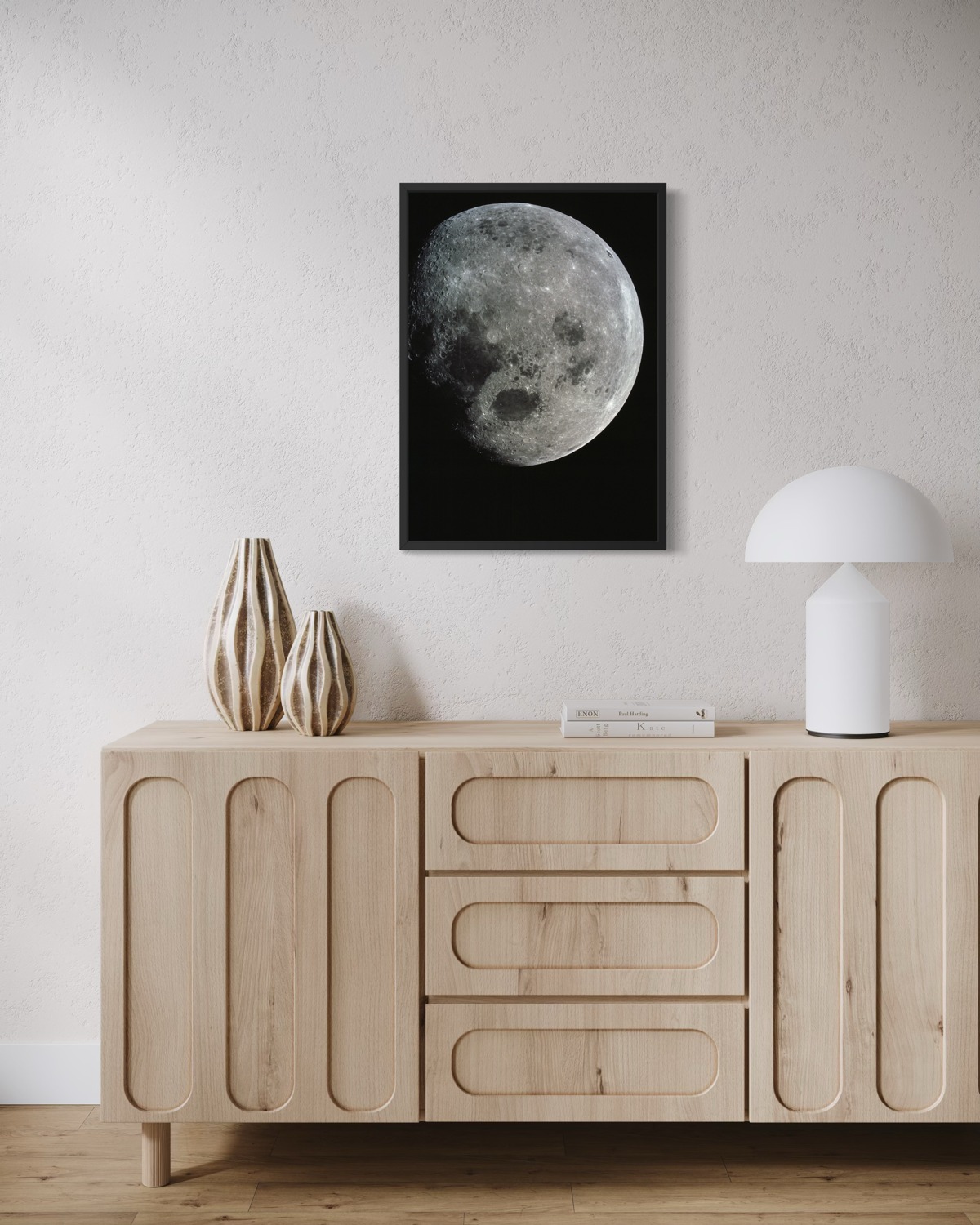 Detailed photograph of the Moon against deep black space, with craters and surface textures clearly visible.