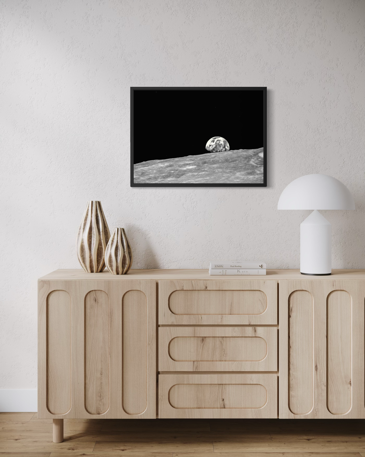 The Earth seen from the Moon, rising above the Moon’s grey, barren surface against the deep black of space.