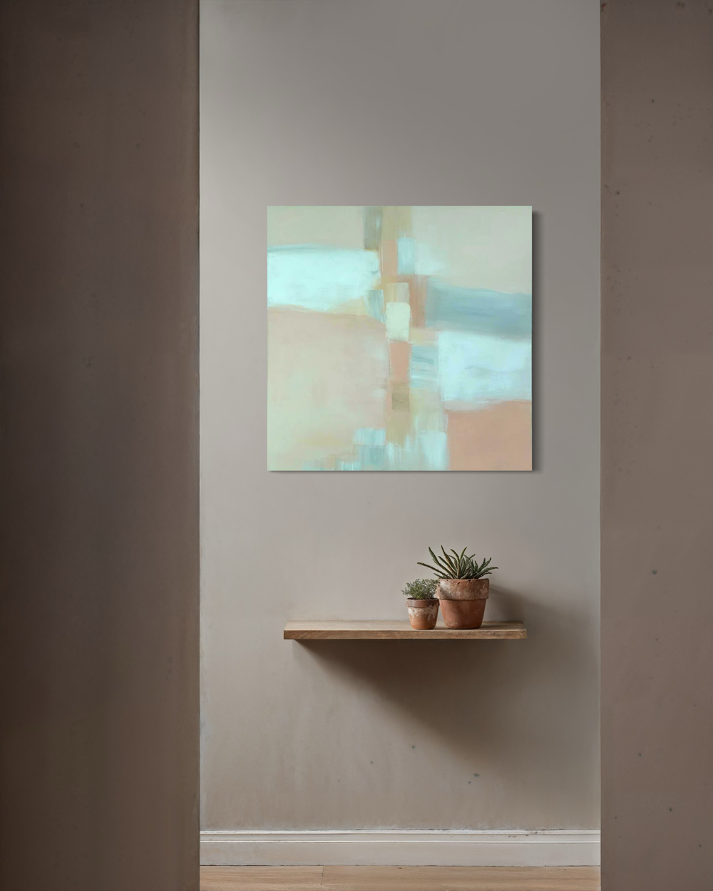 A hand-painted abstract artwork in beige, light blue, and warm earthy tones with soft transitions