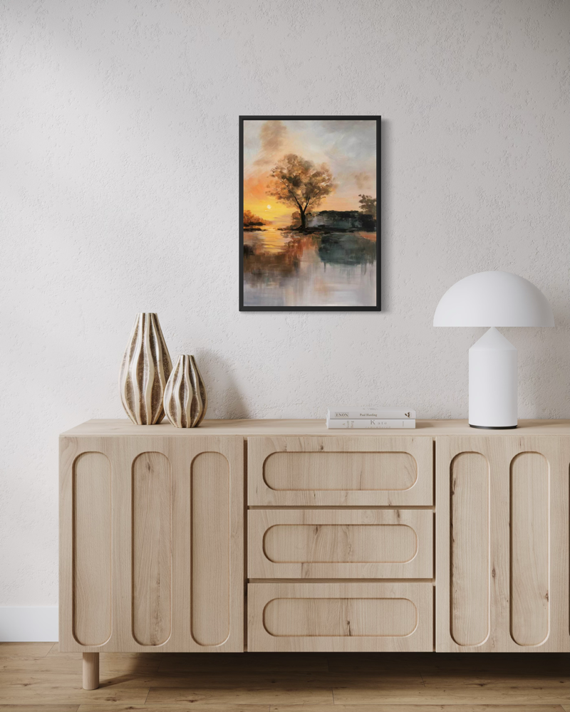 Hand-painted That Evening painting 50x70 cm with black floater frame in warm gold, orange and earthy tones, featuring an atmospheric tree by the water in the evening light.